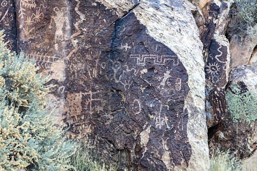 Petroglyphs written by the Hopi Indians at Parowan Gap, Utah. Symbols include clan signs and directional references. It is believed that the Fremont Indians wrote most of the petroglyphs.