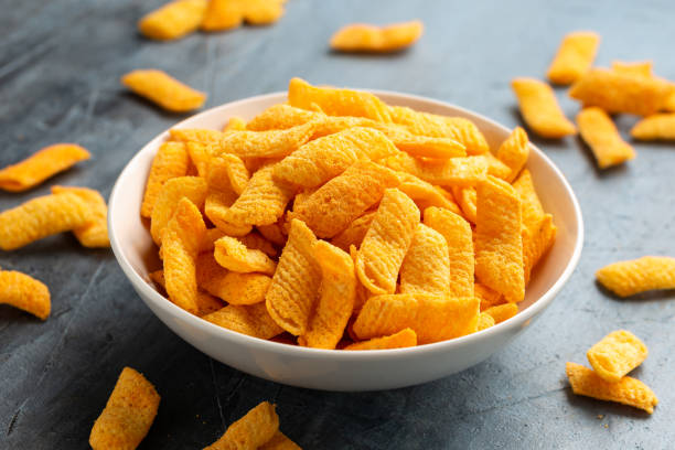 istock Crunchy Nacho cheese corn snack in white bowl 1845275346