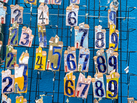 Burano, Italy - November 3 2023: Ceramic numbers as souvenirs. Burano is an island in the Venetian Lagoon, northern Italy, near Torcello