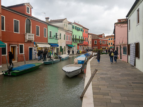 Burano, Italy - November 3 2023: Fondamenta degli Assassini street. Burano is an island in the Venetian Lagoon, northern Italy, near Torcello