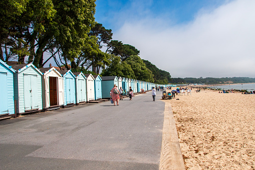 A row of colourful huts along the beachj front