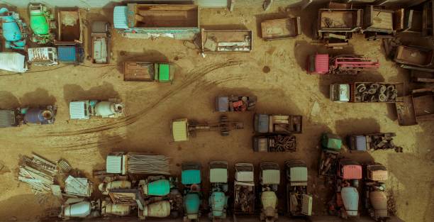 istock old trucks are parked on the sand next to some buildings 1845306408