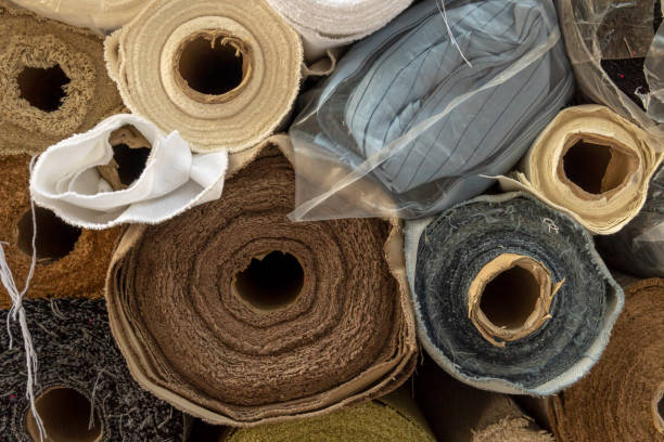 istock Stacked rolls of fabric displayed at a street 1845332136