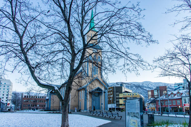 front view of the lutheran cathedral, called "church of norway" at tromso city, norway. - scandinavian church front view norway imagens e fotografias de stock