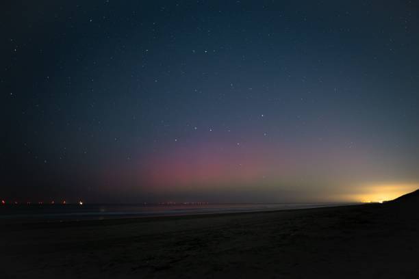 istock Purple northern lights under a starry sky 1845349355