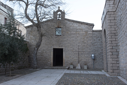 A typical Maltese old building - arched windows, stained glass and limestone.