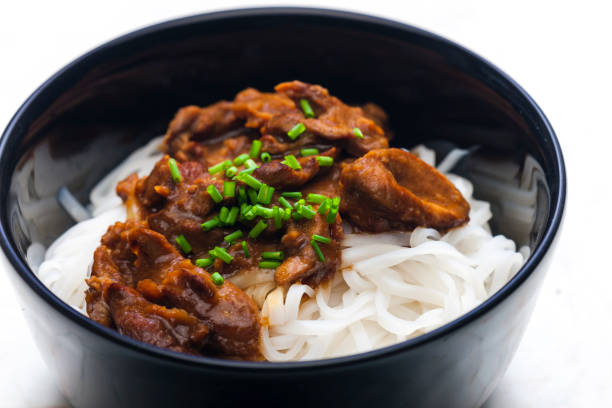 istock meat with sauce served with rice noodles 1845369736