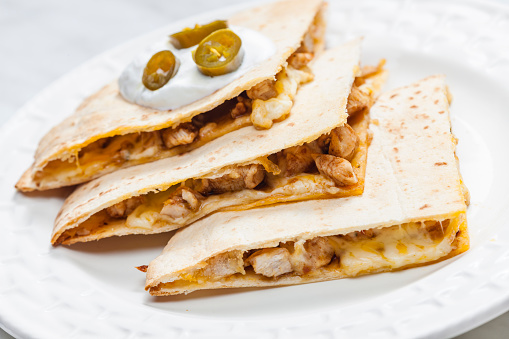quesadilla with chicken meat and jalapenos