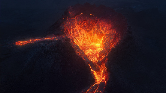 A stunning image featuring a powerful stream of molten lava cascading from a rocky terrain