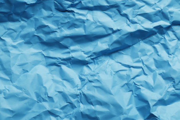 istock Crumpled blue paper as background 1845401090