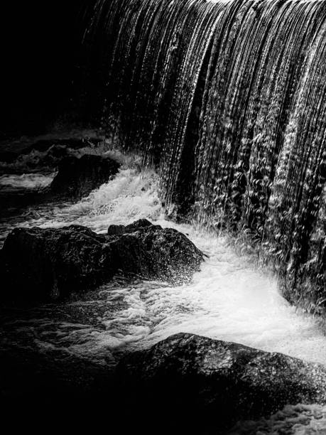 istock Waterfalls on the rock, black and white photo 1845416341