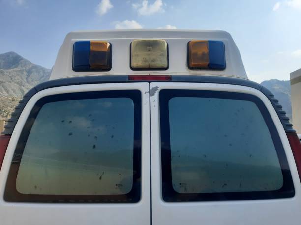 the top of an old ambulance with blue, white and yellow lights - travel healthcare and medicine emergency services urgency imagens e fotografias de stock