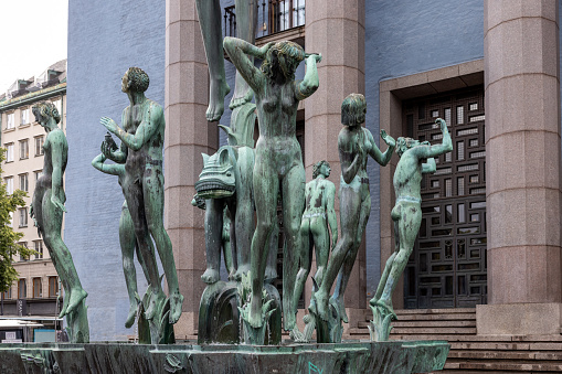 Stockholm, Sweden - July 25, 2023: Bronze fountain, the Orfeus-brunnen by Carl Milles in front of the entrance to the Stockholm Concert Hall