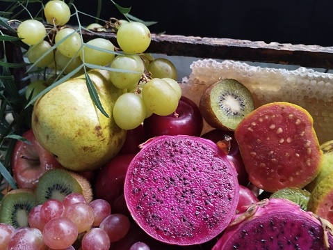 basket with varied fruits grape pear kiwi guava apple healthy food vegan detox food eat taste