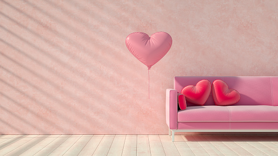Valentine's Day concept with pink sofa and heart pillows. Digitally generated image.