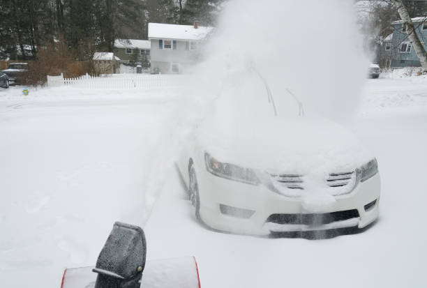 istock snowblower blowing snow on the driveway 1845460348