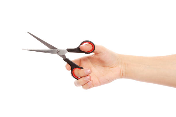 istock Scissors in hand on a white background. isolated. 1845471885