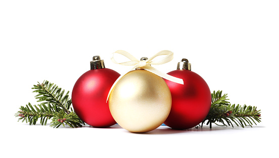 Christmas tree branches and Christmas balls on white background