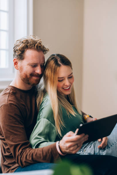 istock Boxes & Clicks: Happy Couple Styles Their New Haven Online 1845489117