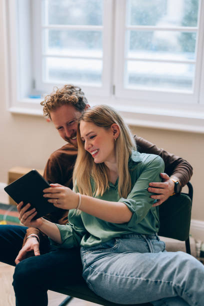 istock Boxes & Clicks: Happy Couple Styles Their New Haven Online 1845489123
