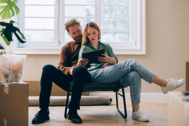 istock Boxes & Clicks: Happy Couple Styles Their New Haven Online 1845489129
