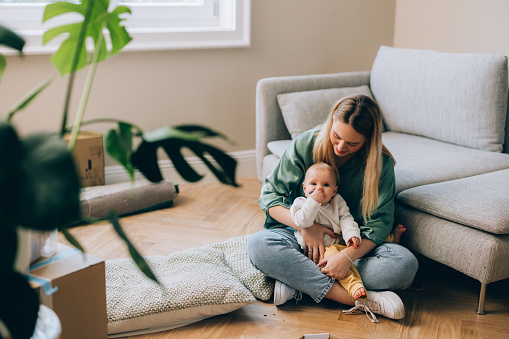 Celebrate the simplicity and love as a mother and her baby settle into a cozy new apartment.