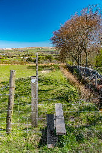 Rural countryside walking footpath fence stile outdoors.