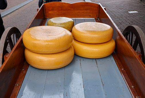 Whole round cheeses for sale at the cheese market in Gouda, the Netherlands