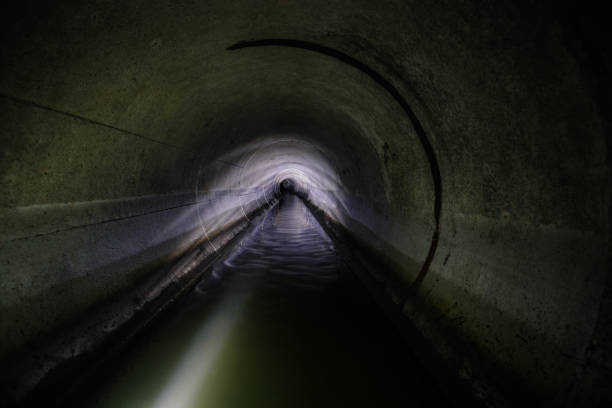 istock Industrial wastewater and urban sewage flowing through round sewer pipe 1845501708