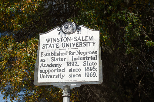 Winston Salem, North Carolina - October 27, 2023:  Historic Marker sign for Winston-Salem State University located near the entrance to campus in Winston-Salem, North Carolina.