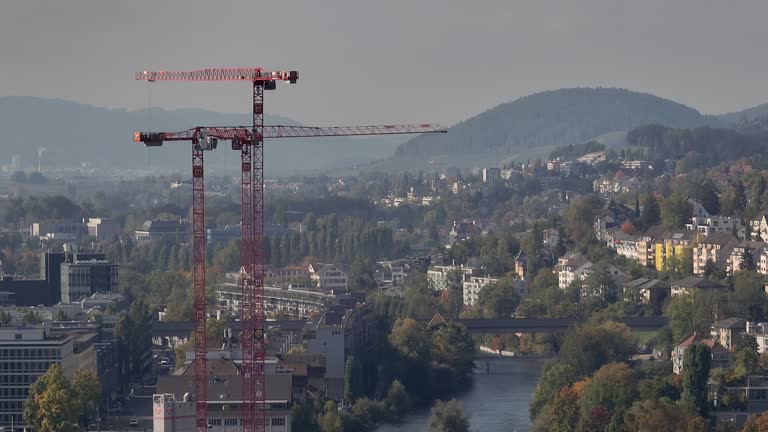 sunny day zurich city center construction cranes aerial panorama 4k switzerland