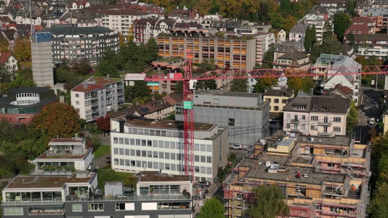 sunny day zurich city center construction cranes aerial panorama 4k switzerland