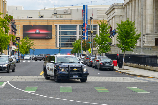 Metro Police SUV driving with lights flashing on a call outside the National Portrait Gallery in Washington DC