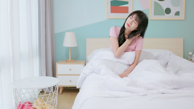 asian woman wakeup with backpain