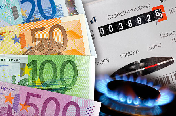 high costs for energy euro cash, gas flame and electric meter as symbol for expensive energy costs price tag photos stock pictures, royalty-free photos & images