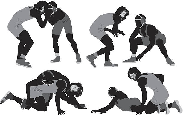 Silhouette of wrestlers in action vector art illustration