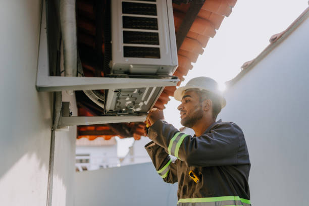 technician checking air conditioning unit - klima stok fotoğraflar ve resimler