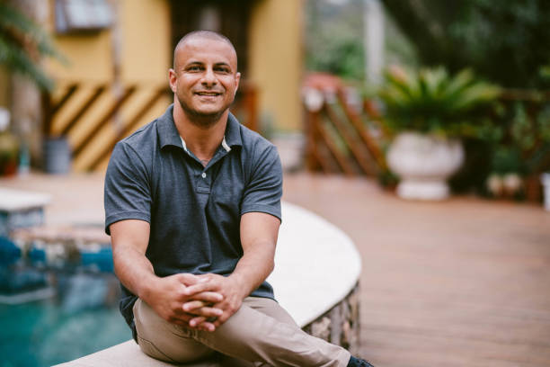 istock Smiling man standing outside on a his patio with a scenic view 1845684217