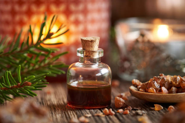 Christmas essential oil with myrrh resin and a candle
