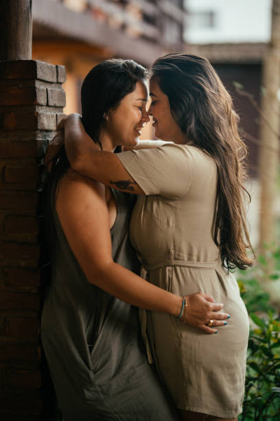 istock Loving young couple standing outside and hugging each other 1845711689