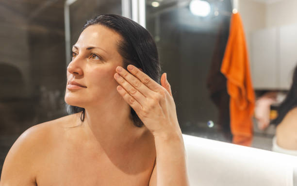 Woman Applying  Face Cream
