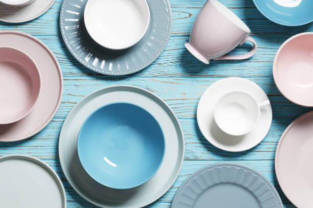 istock Flat lay composition with dishware and cutlery on blue table 1845736960