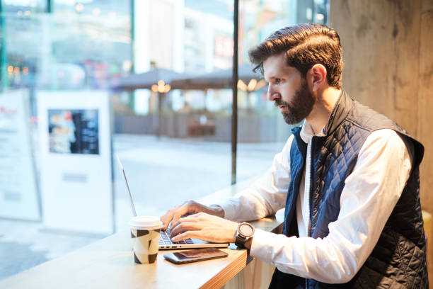 istock Businessman working with laptop in a cafe 1845747985