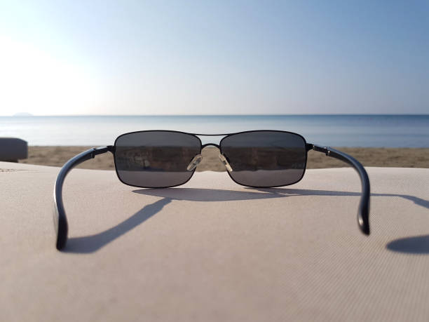 istock Sunglasses on the seashore, summer postcard 1845762516