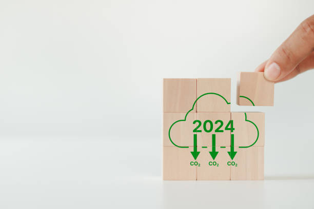 istock Green business, Reducing carbon emissions target in 2024. Climate action, carbon offset, neutrality strategies and environmental sustainability. 2024 written on wooden cubes and decarbonization icons 1845766196