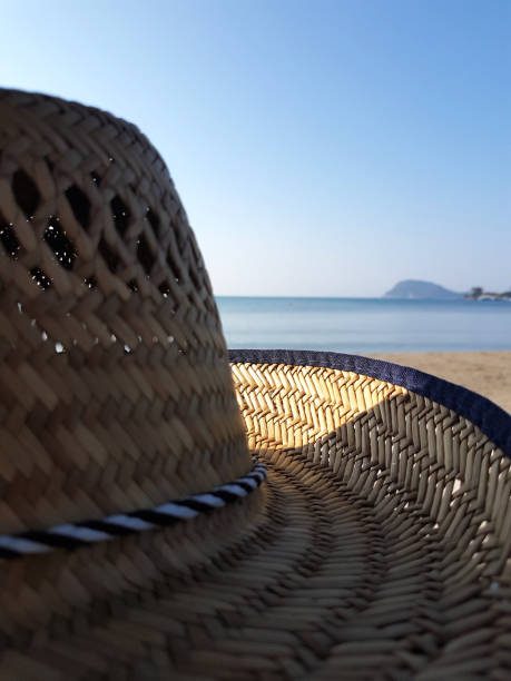 istock Straw hat on the seashore, summer postcard 1845784394