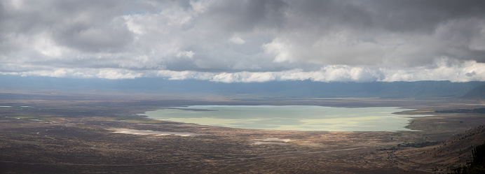 Beautiful panoramic view from above with beautiful light of ngorongoro crater overlooking alkaline lake Makati - Tanzania