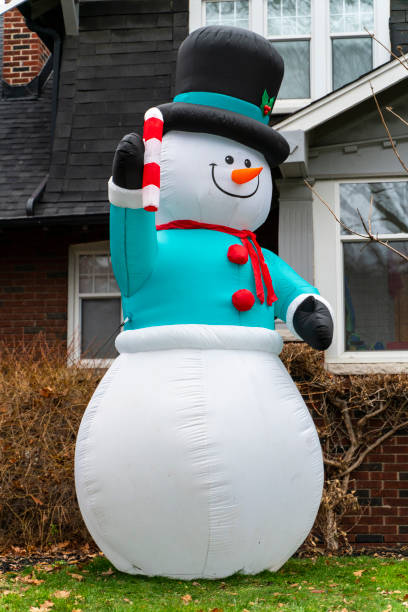 istock Frosty the Snowman Inflatable on Front Lawn 1845844875