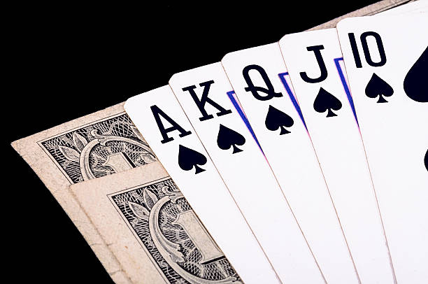 istock Flush royal cards with money 184584589