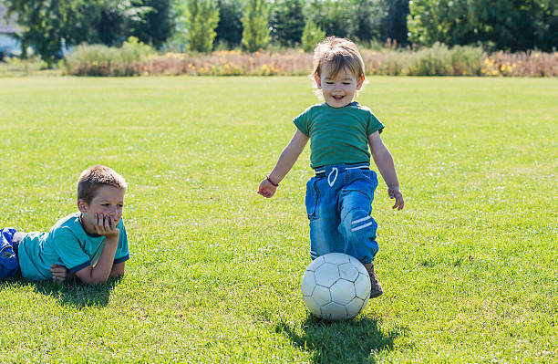 istock kid's on football field 184584657